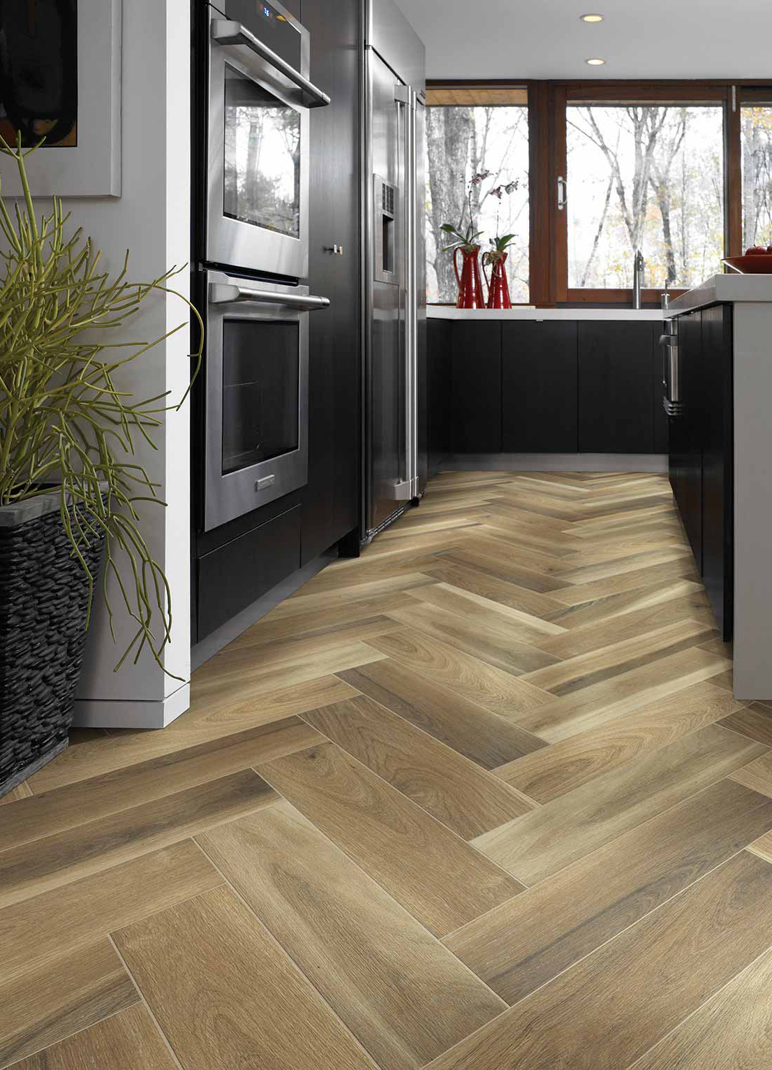 Tile floor in a herringbone patter in a kitchen from Top Notch Flooring America in Bel Air, MD