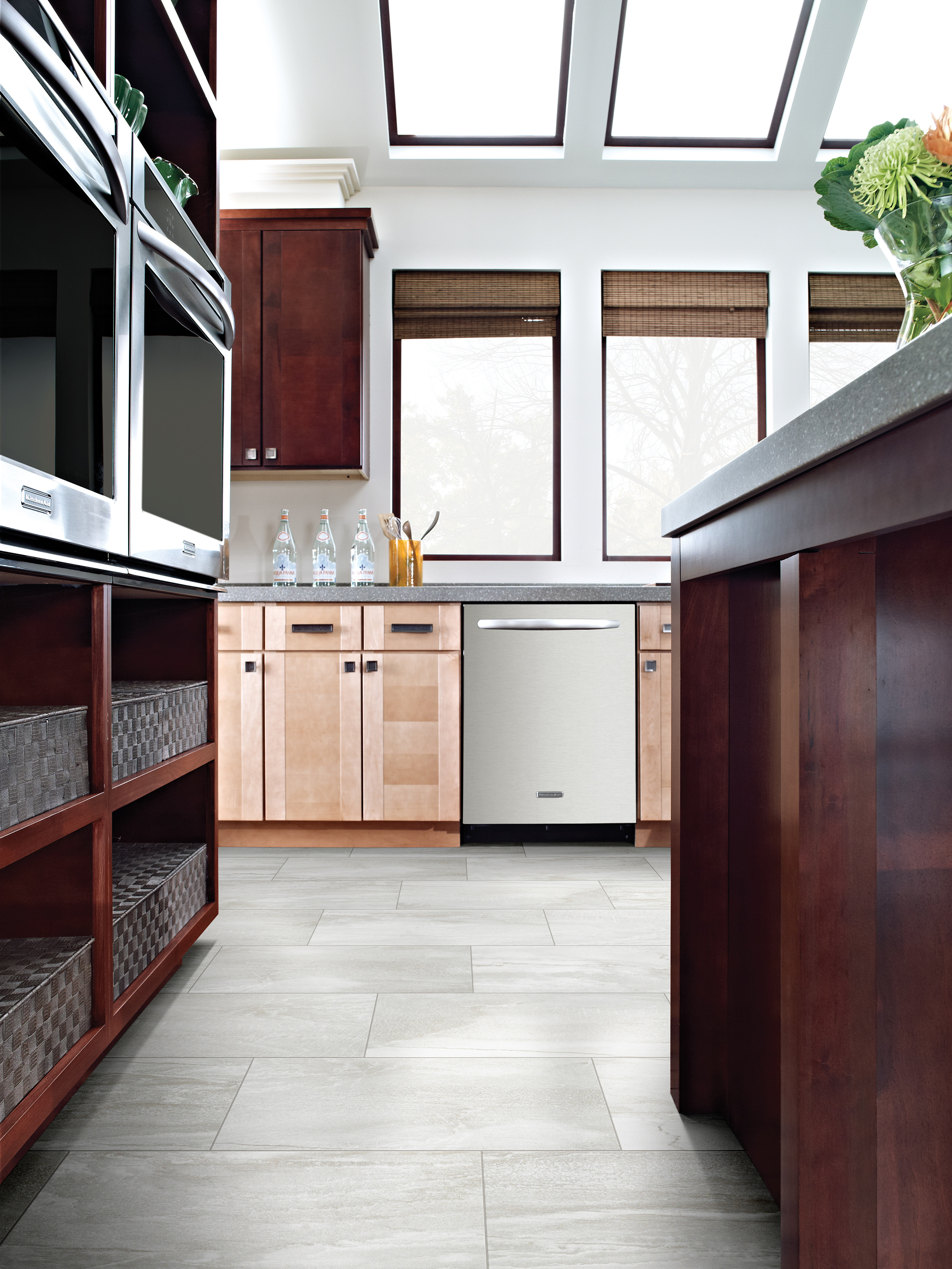 Tile floor in a kitchen with cabinets and ovens on either side of the flooring from Top Notch Flooring America in Bel Air, MD