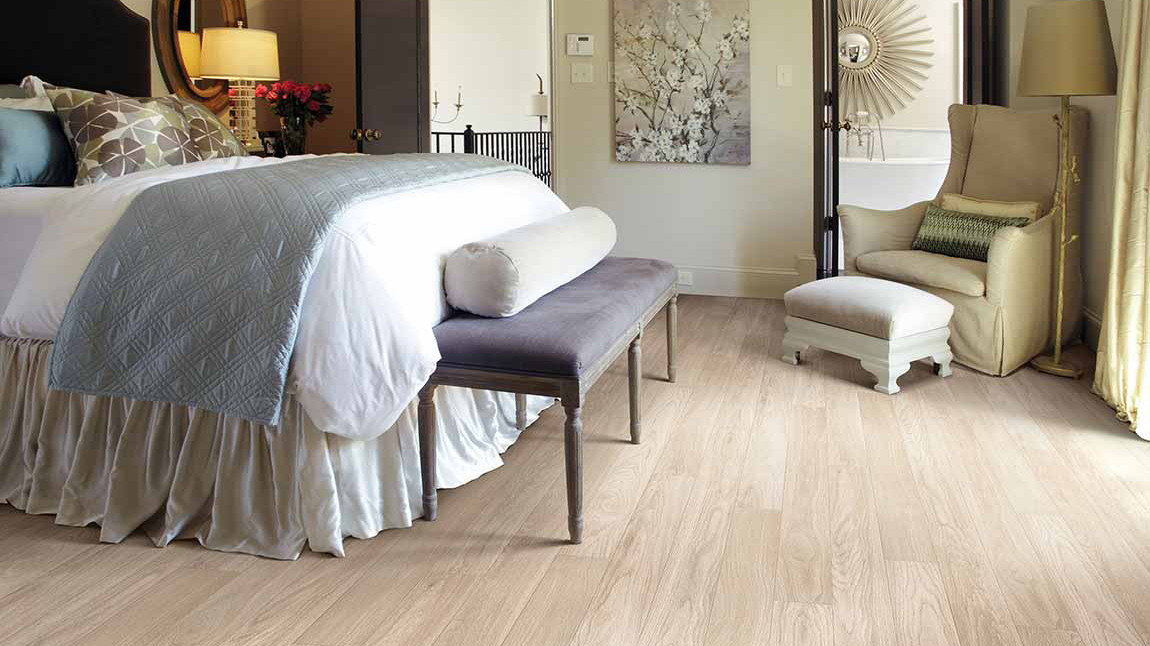 Laminate wood floors in bedroom from Top Notch Flooring America in Bel Air, MD