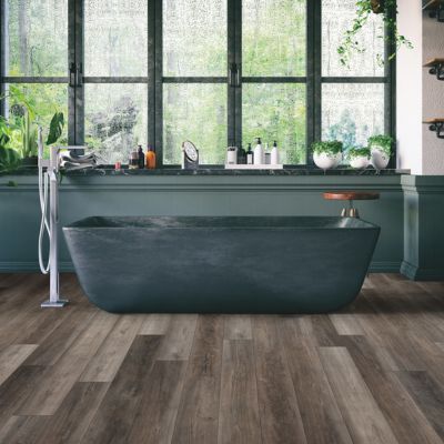 luxury vinyl plank flooring in a monochrome green bathroom
